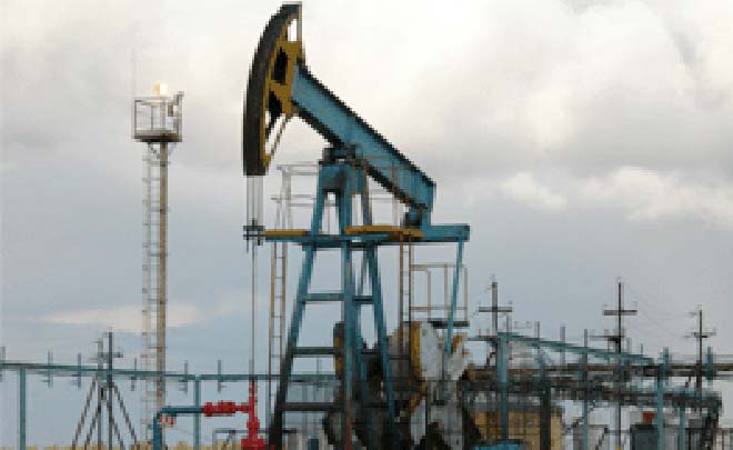 Oil prices rise on weak dollar, OPEC output cuts
