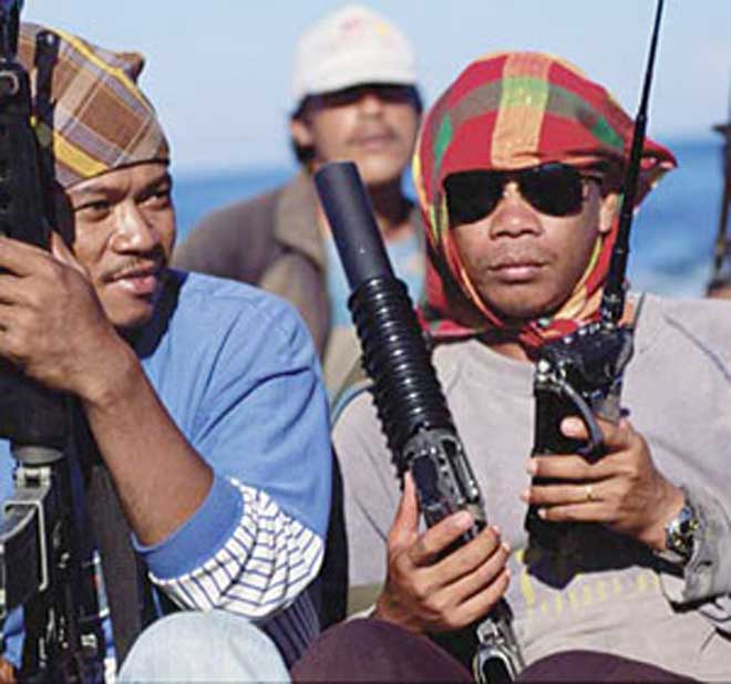 Somali pirates holding dhows with Indian crew