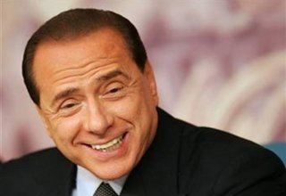 Berlusconi backs Deneuve on male courtship