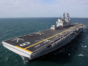 Iran tells departed U.S. carrier not to return