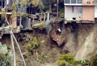 About 150 may be trapped in landslide in India
