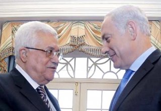 Netanyahu, Abbas shake hands at Peres’ funeral