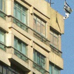 Egyptian protester yanks down Israeli embassy flag again