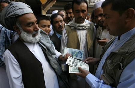 Afghanistan imposes currency curbs in response to Iran rial dive