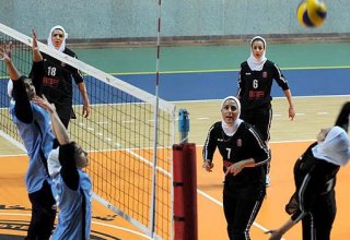Iranian woman athlete holds hijab, becomes champion