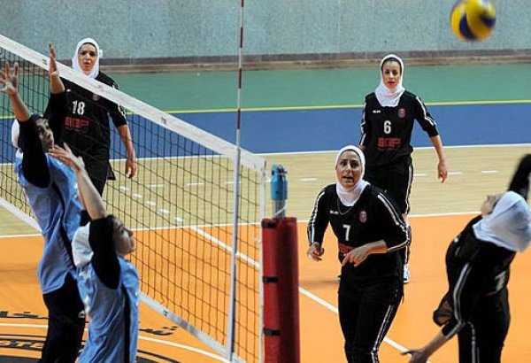 Iranian woman athlete holds hijab, becomes champion