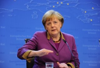 Merkel's coalition gets poll boost from Ukraine crisis mediation