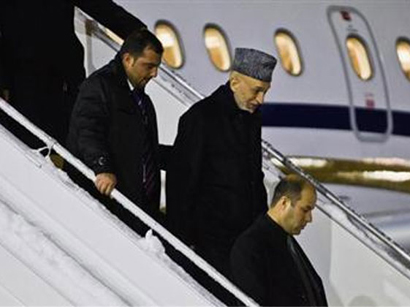 Karzai arrives in Qatar to discuss possible Taliban peace talks