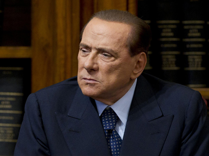 Italy's Berlusconi hospitalized but vows to resume campaign