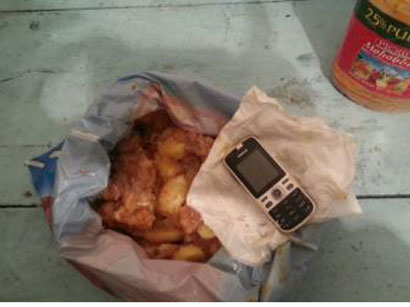 İstintaq təcridxanasında toyuq ətindən hazırlanmış yeməyin içindən telefon çıxdı