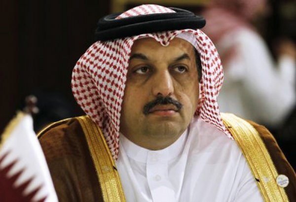 Qatar backs Syria political solution on Iran visit