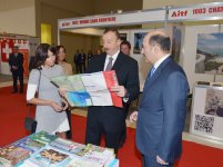 Azerbaijani president and his spouse attend exhibitions in Baku (PHOTO)