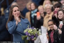 Kate shows off a silver streak: Duchess of Cambridge's stylish up-do inadvertently reveals a glimpse of grey (PHOTO)