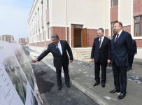President Ilham Aliyev reviews newly-built residential complex for IDP families in Mingachevir