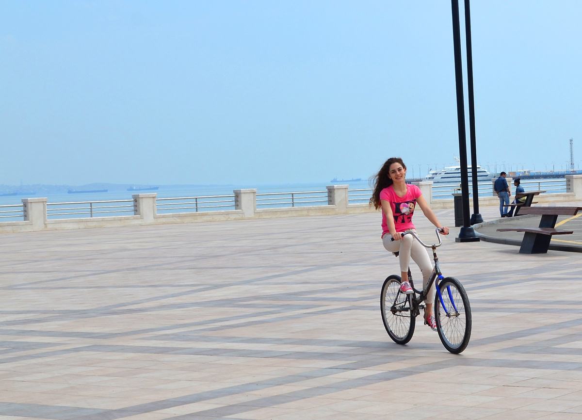 Youth pushing pedals on Baku Boulevard on eve of European Games