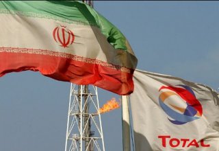 Total: Final Iran investment depends on renewal of US waivers