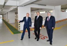 President Ilham Aliyev attends opening of multistory car park in Baku