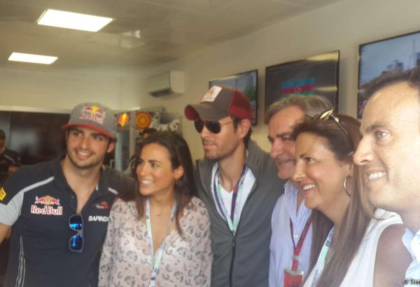 Enrique Iglesias visits pit boxes of teams participating in F1 Grand Prix of Europe in Baku