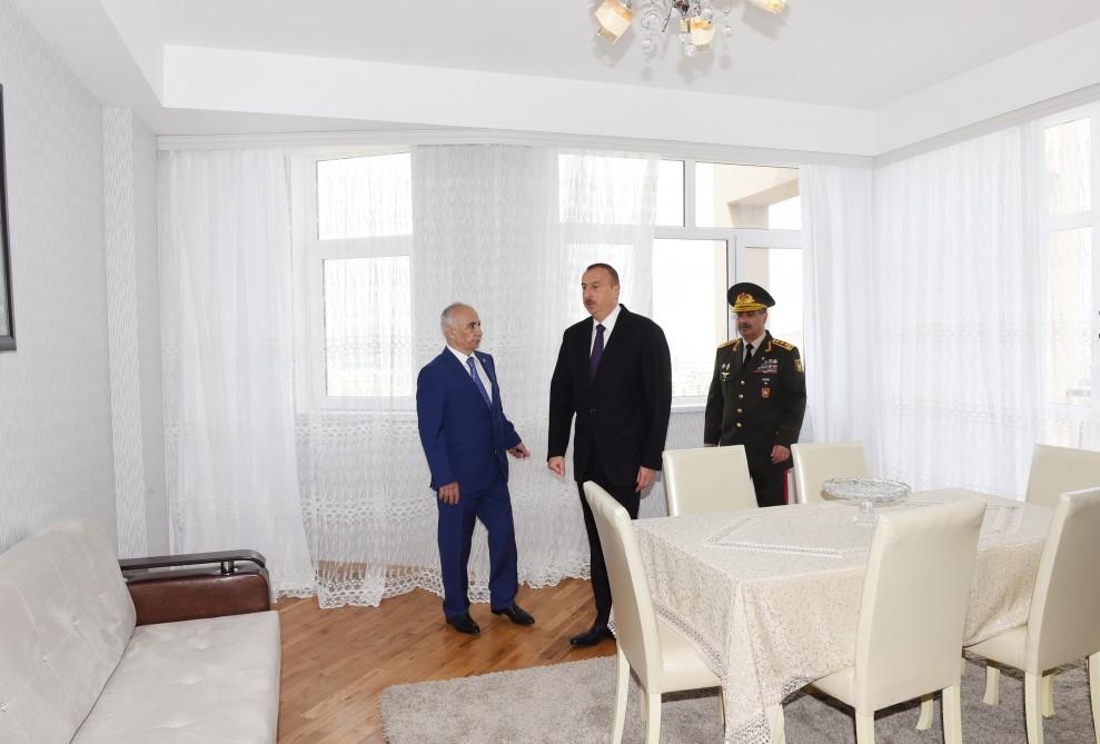 President Aliyev views residential building for servicemen