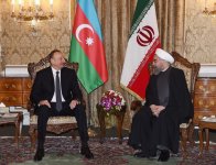 Ilham Aliyev, Hassan Rouhani meet in limited format (PHOTO)