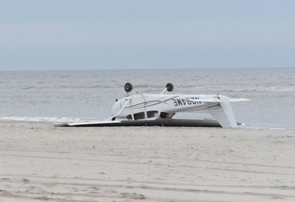 Small plane flips, lands upside down on New York beach