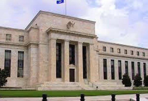 Fed holds rates steady, to slow balance sheet reduction
