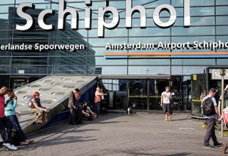 Man held at Amsterdam airport after bomb threat; departure hall reopens