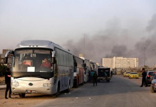 Thousands leave Ghouta in surrender of enclave to Syrian government