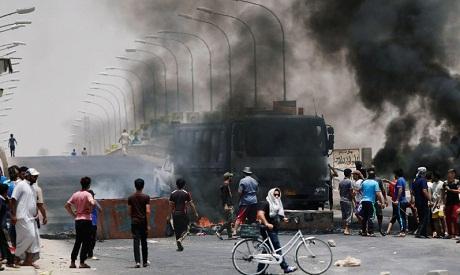 Iraqi forces shoot three dead in southern city as protests flare