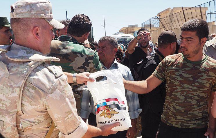 Russian officers deliver humanitarian aid to ancient Syrian city of Maaloula