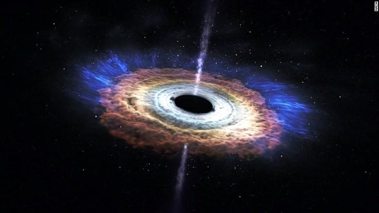 Scientists reveal first image of black hole