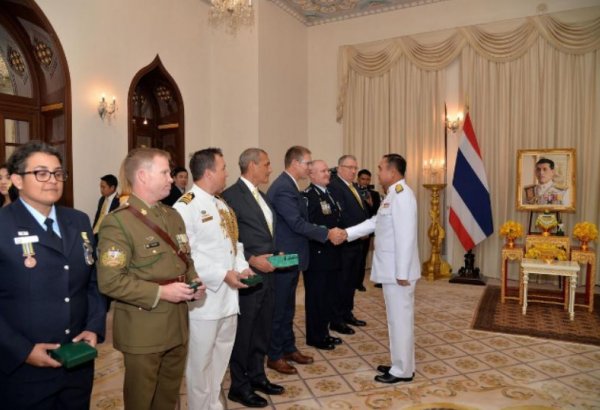 Thai king confers awards on two Australian divers for rescue of cave boys
