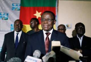 Cameroon president orders main rival freed in bid to calm tensions