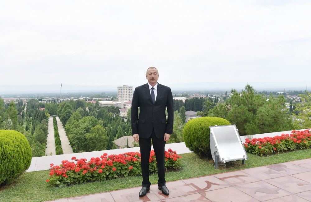 Azerbaijani president lays flowers at statue of national leader Heydar Aliyev in Balakan (PHOTO)