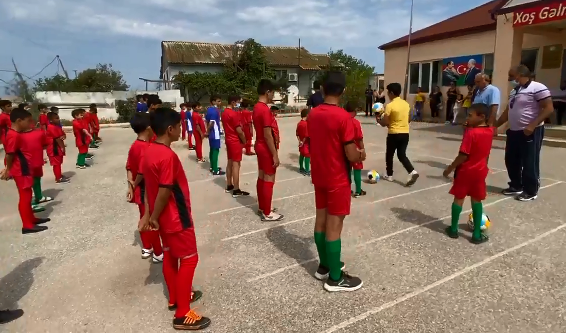 Azerbaijani MPs present football uniforms to IDP school children (VIDEO)