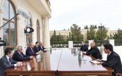 President Ilham Aliyev receives delegation led by Turkish Foreign Minister (PHOTO)