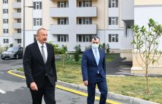 Azerbaijani president attends ceremony to give out apartments and cars to families of martyrs and war disabled in Khojasan settlement  (PHOTO)