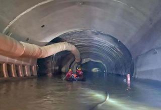 Death toll in China flooded highway tunnel rises to 13