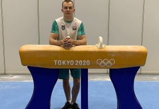Azerbaijani athlete performs pommel horse exercise as part of competitions at 2020 Summer Olympics in Tokyo