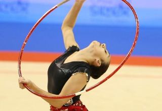 Azerbaijani gymnast presents exercise with hoop at Tokyo Olympics