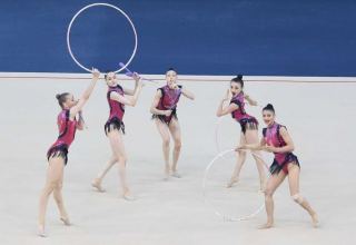Azerbaijani team presents exercise with three hoops and two pairs of clubs as part of Tokyo 2020
