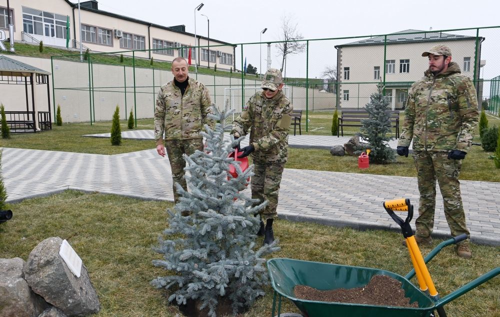President Ilham Aliyev, First Lady Mehriban Aliyeva and their son Heydar Aliyev plant tree on territory of military unit in Hadrut