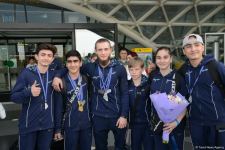 Avropa Çempionatında medallar qazanmış gimnastlar Azərbaycana qayıdıb (FOTO)