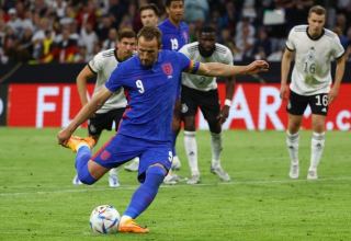 Kane's 50th England goal earns draw in Germany