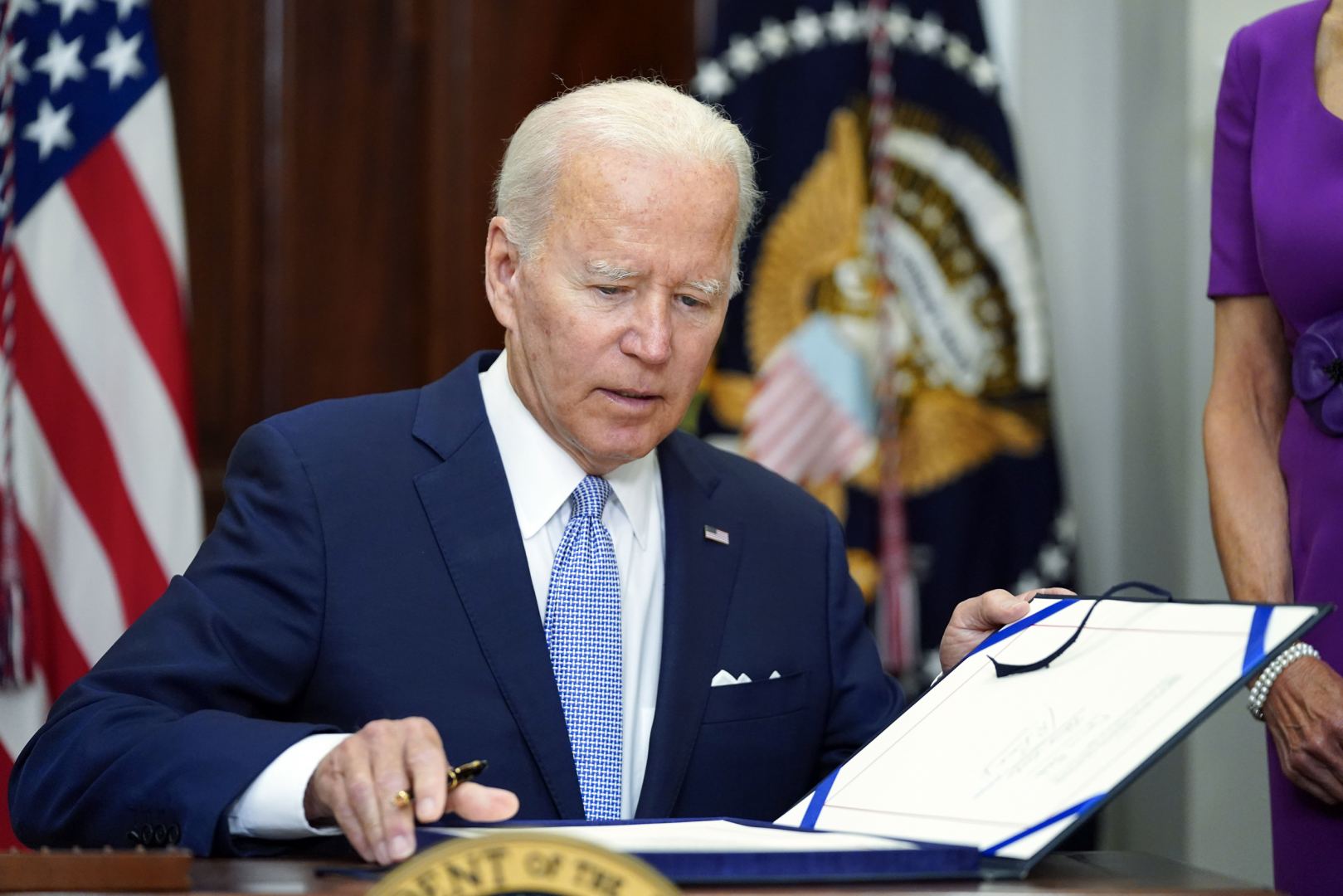 Biden signs Democratic bill on tax, health care, climate