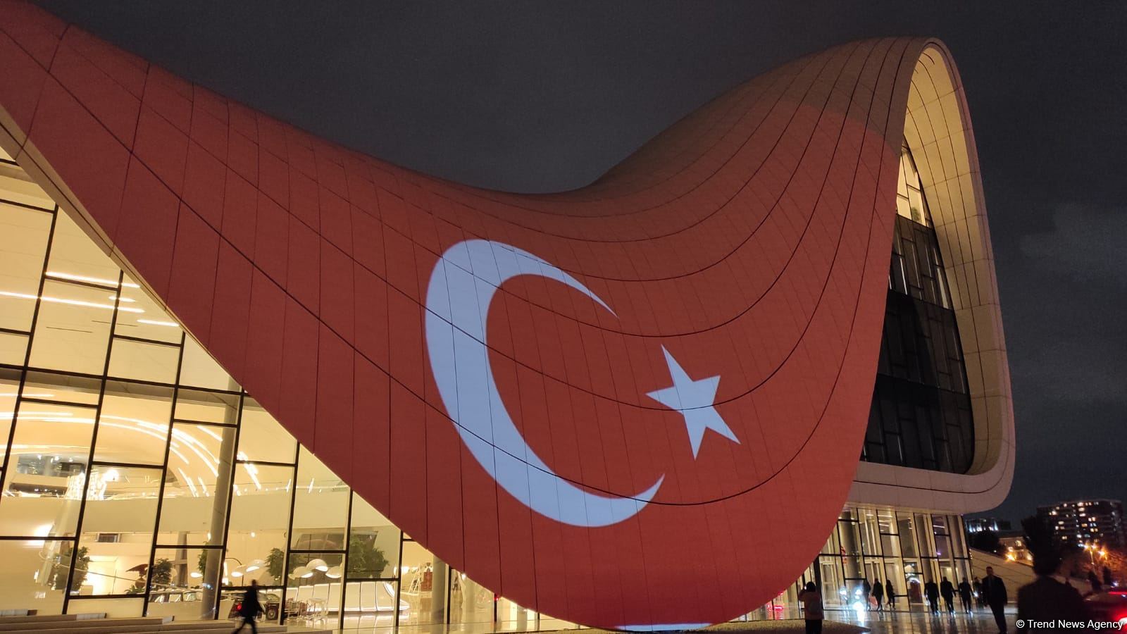 Building of Baku's Heydar Aliyev Center painted in colors of Turkish flag
