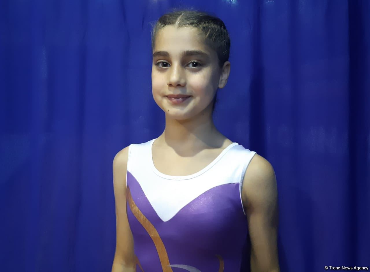 Young athlete talks on achieving high results in trampoline gymnastics