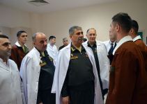 Azerbaijani defense minister visits military hospital on occasion of Novruz holiday (PHOTO/VIDEO)
