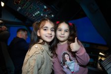Martyrs' children visit flight training center (PHOTO)