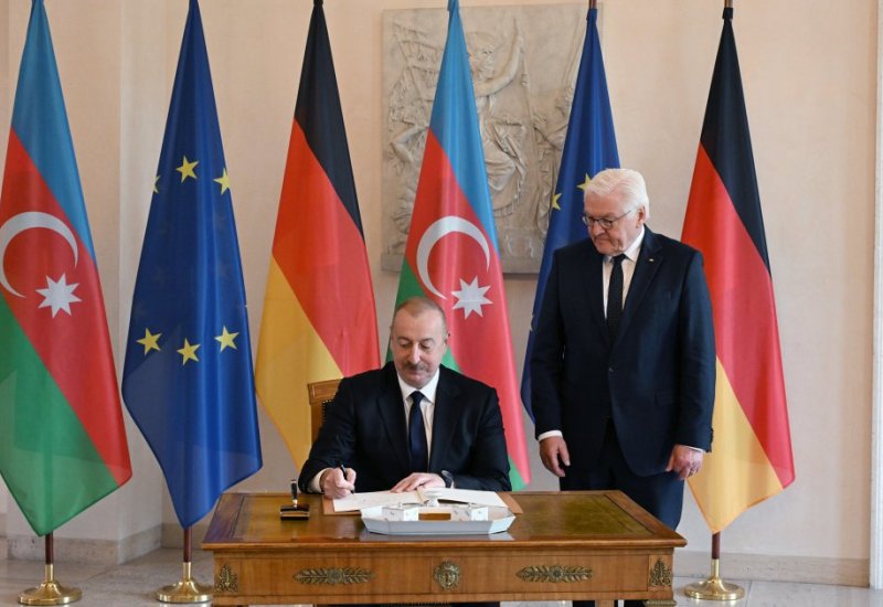 President Ilham Aliyev signs Guest Book at German president's residence